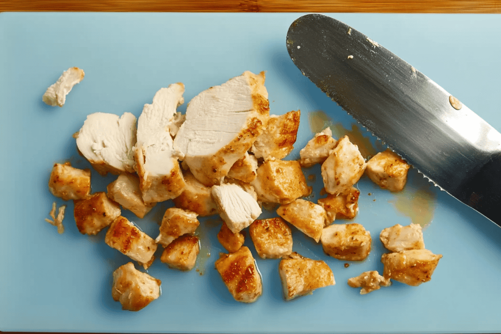 transfer chicken to a cutting board cut into